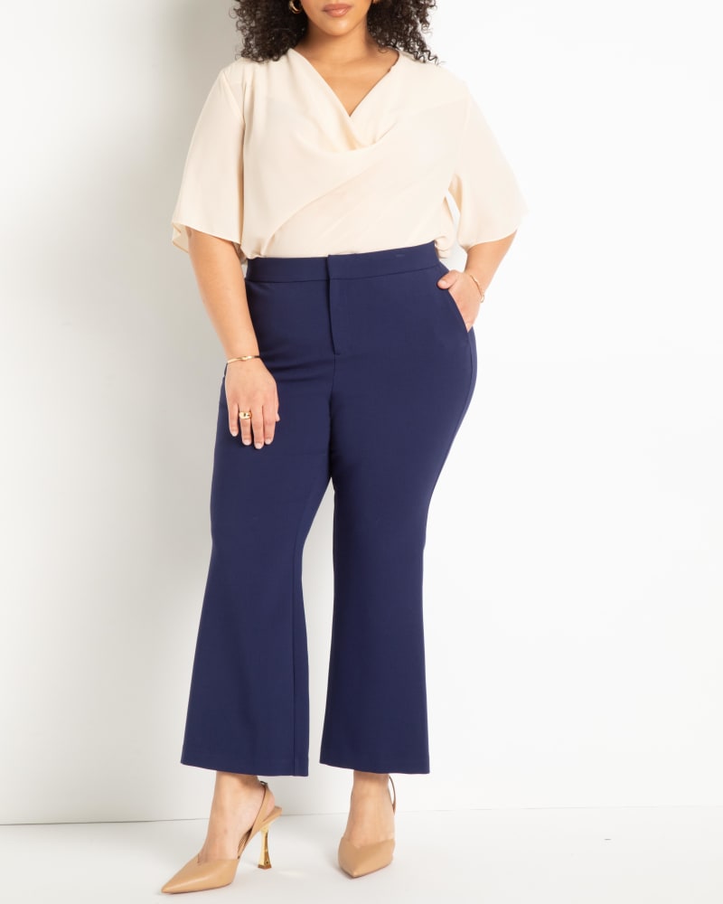 Front of a model wearing a size 20 The 365 Suit Crop Flare Leg Trouser in Ocean Cavern by ELOQUII. | dia_product_style_image_id:272932